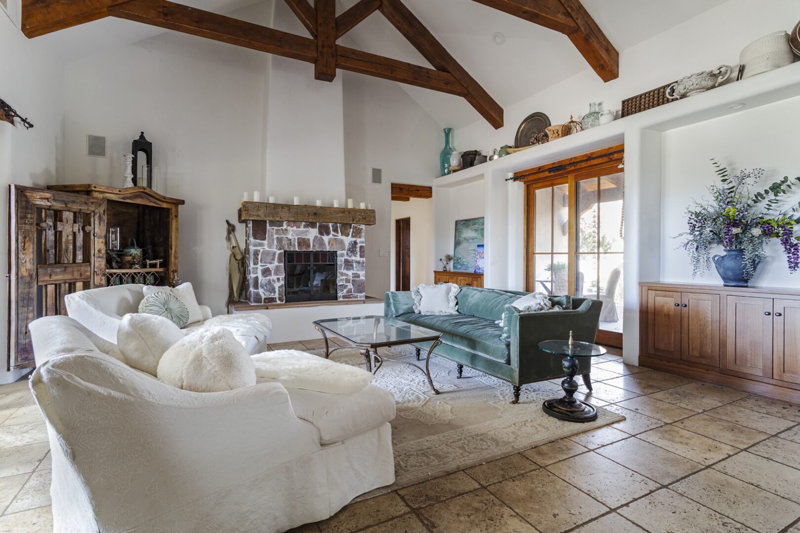 Rustic living room with exposed wooden beams.